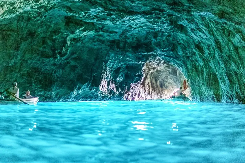 The luminous turquoise water inside the Blue Grotto sea cave